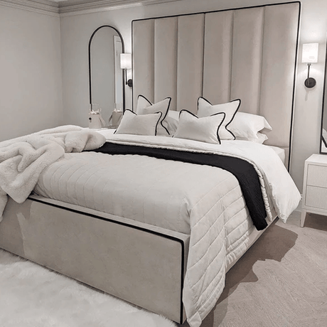 tall headboard in cream panels with black piping border